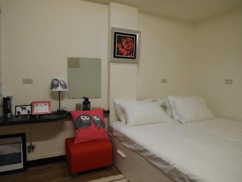 Ένα ή περισσότερα κρεβάτια σε δωμάτιο στο Jia Mei Fa Homestay