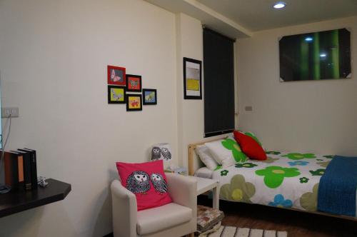 Ένα ή περισσότερα κρεβάτια σε δωμάτιο στο Jia Mei Fa Homestay