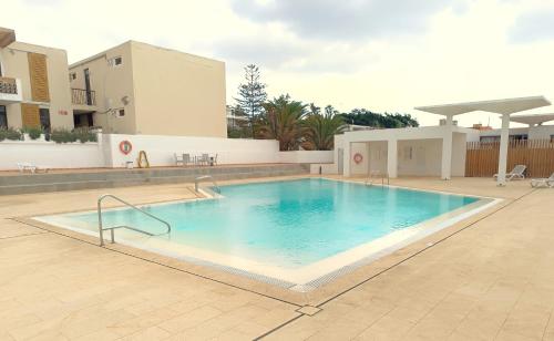 a large swimming pool in the middle of a building at Apartment La Fiesta in Arona