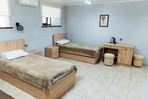 Tempat tidur dalam kamar di Мисливець в Комплексі "Сокіл"