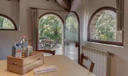 a table in a room with a tableablish at Fattoria Agriturismo Nerbona in Casole dʼElsa
