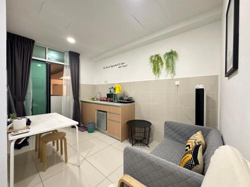 a living room with a couch and a table at SA Sutera Avenue Homestay Kota Kinabalu Area KK City Opposite Imago in Kota Kinabalu
