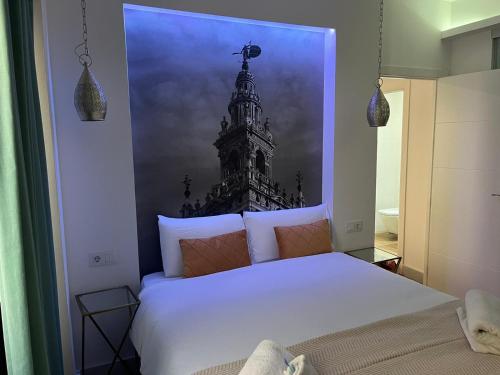 Een bed of bedden in een kamer bij Deluxe Artemisa Sevilla