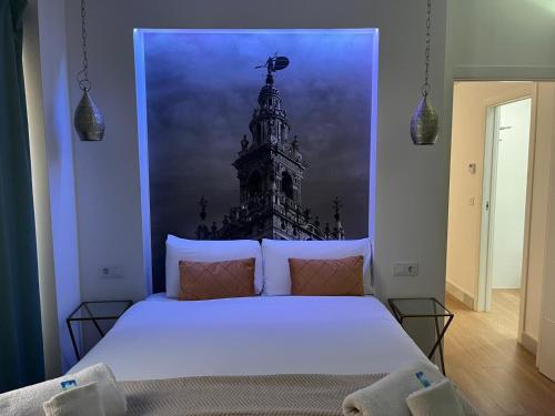 Een bed of bedden in een kamer bij Deluxe Artemisa Sevilla