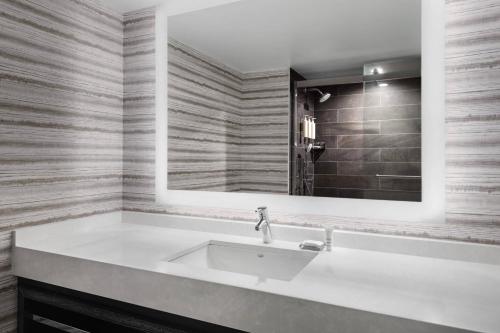 a bathroom with a sink and a mirror at Bridgewater Marriott in Bridgewater