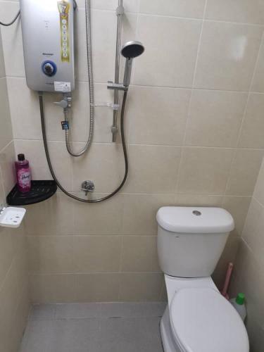 a bathroom with a shower with a white toilet at D'Parking Homestay Klia Sepang Budget Murah in Banting