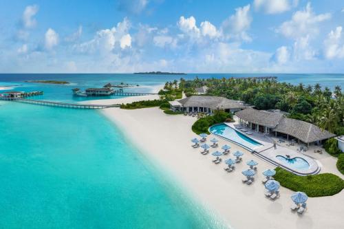 an aerial view of a resort on the beach at Le Méridien Maldives Resort & Spa in Lhaviyani Atoll