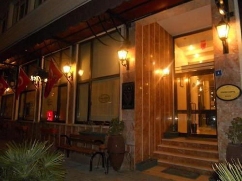 a building with a bench in front of it at Samsun Otel Vidinli in Samsun