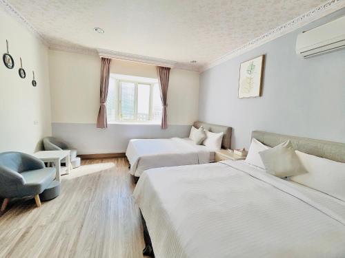 Una cama o camas en una habitación de 墾丁儷庭民宿Li Ting B&B