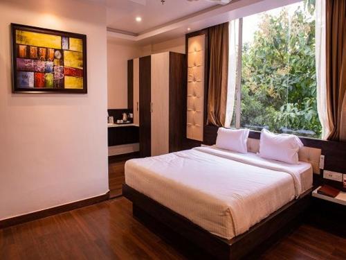 Tempat tidur dalam kamar di Welcome Resorts And Spa