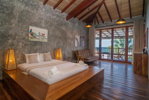 a bedroom with a large bed in a room at Timeless villa in Ahangama