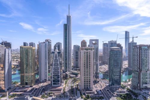 an aerial view of a city with tall buildings at Heaven Crest Vacation Homes Dubai Marina - 4 Bedroom Suite with Marina View near JBR Beach, Free Parking, Wi-Fi, Gym and Pool in Dubai