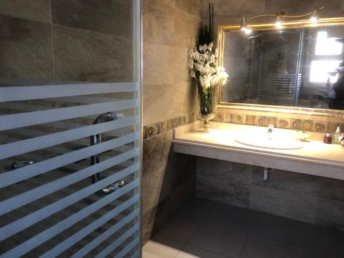 a bathroom with a sink and a mirror at Telal sokhna villa families only in Ain Sokhna