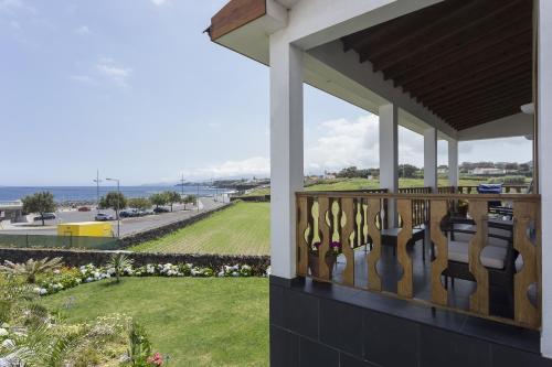 a balcony of a house with a view of the ocean at Casa Varanda do Mar in Capelas
