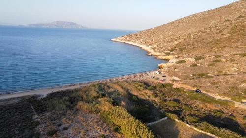 an aerial view of a beach next to the water at Dream catcher 4 in Ios Chora