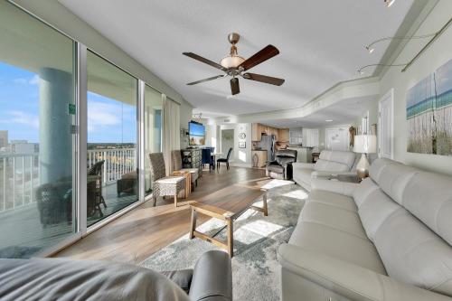 a living room with a couch and a ceiling fan at Palazzo 408 in Panama City Beach