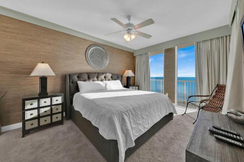 a bedroom with a bed and a large window at Palazzo 408 in Panama City Beach
