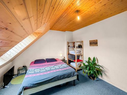 a bedroom with a bed and a wooden ceiling at SeaHaven in Saint-Brieuc