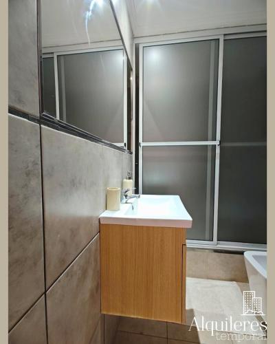 a bathroom with a sink and a shower at bv colon 351 apart firmat 1 in Firmat