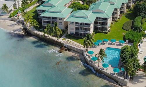 an aerial view of a resort with a swimming pool at Plantation Village # 64 Seven Mile Beach Fully Renovated Modern 2 Bed 2 Bath in George Town