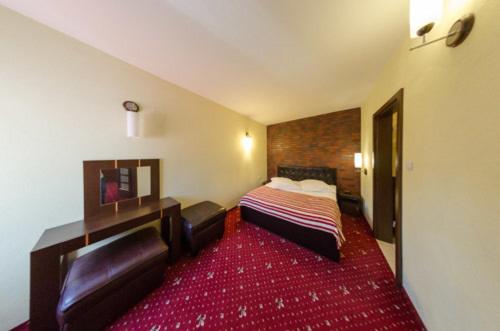 Ένα ή περισσότερα κρεβάτια σε δωμάτιο στο Amadeus Hotel Zielona Góra