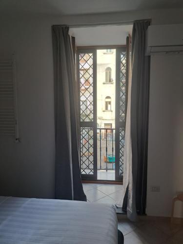 Postel nebo postele na pokoji v ubytování Stop al Duomo