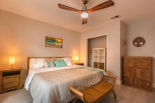 a bedroom with a bed and a ceiling fan at NEW Stylish & Cozy Dune Daisy near Beach & Flagler in New Smyrna Beach