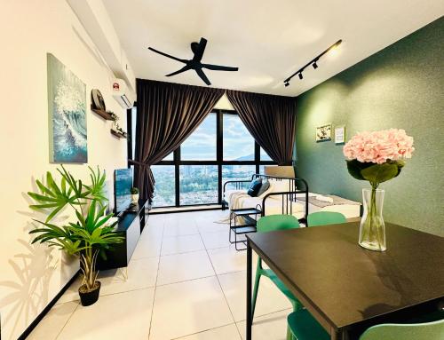 a living room with a table and a dining room at New 2BR or 3BR Cozy Urban Suite Homestay at Georgetown8-10pax by URBAN STAYCATIONS LOD in Jelutong