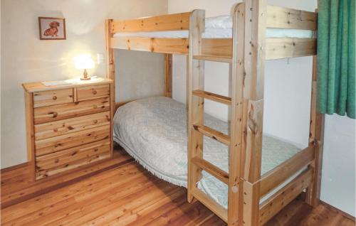 a bedroom with two bunk beds and a dresser at Cozy Apartment In Klein St, Paul With Kitchen in Eberstein