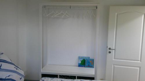 a bedroom with a bed and a white door at Unseburger Brauhaus GmbH Ferienwohnung 2 in Unseburg
