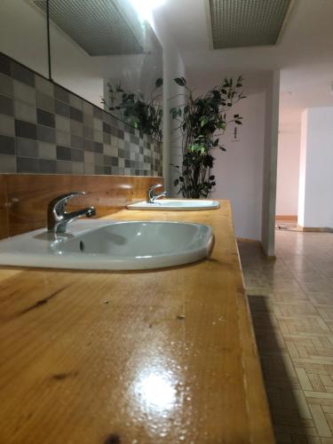 a bathroom with a sink in a room at Urban rest zone and coworking in Arrecife