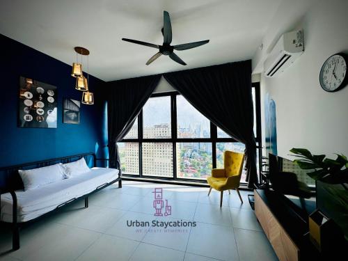 a bedroom with a bed and a ceiling fan at New 2BR or 3BR Cozy Urban Suite Homestay at Georgetown8-10pax by URBAN STAYCATIONS LOD in Jelutong
