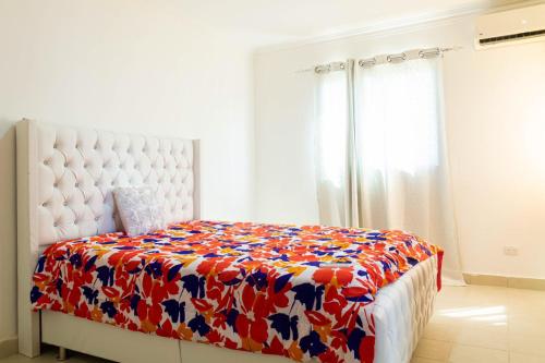 Tempat tidur dalam kamar di Apartamento en Pueblo Bavaro