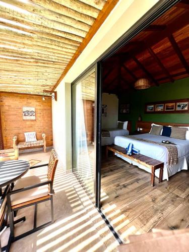 Ένα ή περισσότερα κρεβάτια σε δωμάτιο στο Pousada Villa Canaã