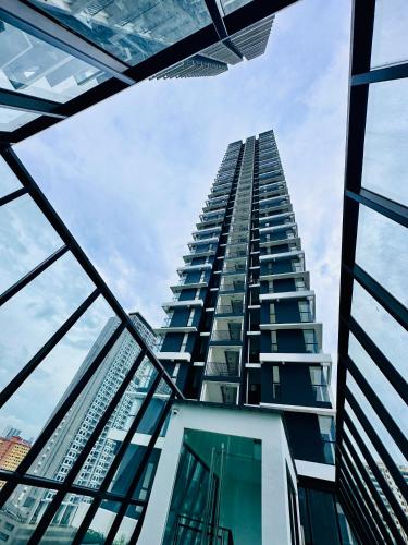 a tall building looking up into the sky at New 2BR or 3BR Cozy Urban Suite Homestay at Georgetown8-10pax by URBAN STAYCATIONS LOD in Jelutong