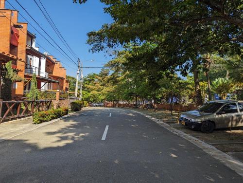 an empty street with a car parked on the side at Apartasol en San Jerónimo, Ciudadela del Sol - Cammar in San Jerónimo