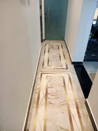 a hallway with a tile floor in a room at شقه مفروشه كورنيش المعادى in Cairo