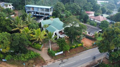 an aerial view of a house with a street at Crown Resort in Nuwara Eliya