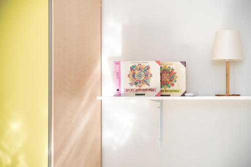 a white refrigerator with a lamp on top of it at Piperitsa house for nomads or families in the countryside in Messini