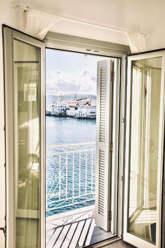 a balcony with a view of the water at Seaside Serenade 1, suite in Ermoupoli