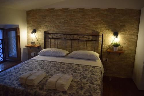 Letto o letti in una camera di Baita delle Rocche