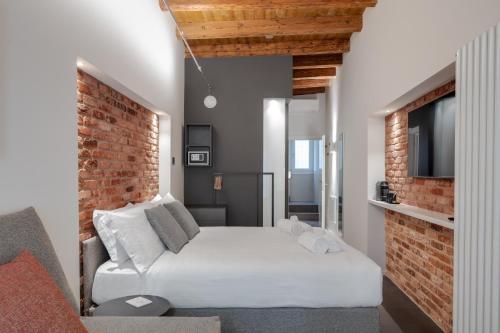 Postel nebo postele na pokoji v ubytování Forum Suites