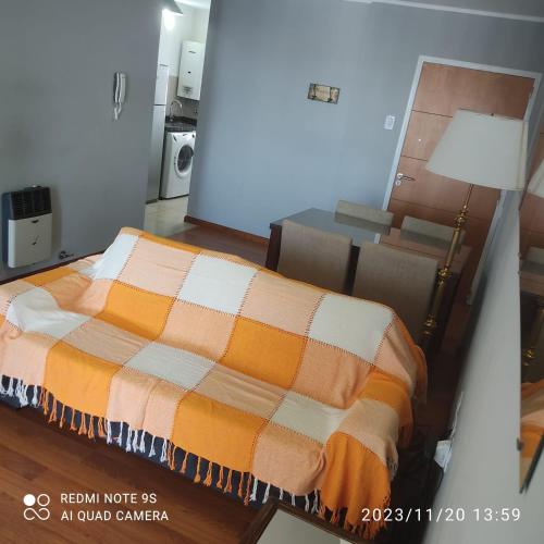a bedroom with a bed and a lamp in a room at Gaudium in Paraná