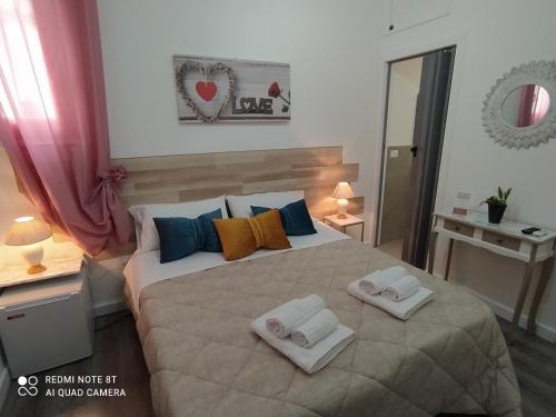Cama o camas de una habitación en B&B A Modo Mio