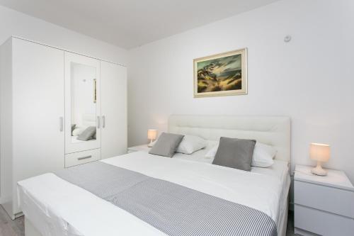 Posteľ alebo postele v izbe v ubytovaní Apartment Dupčić