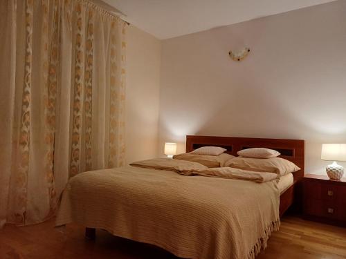 Posteľ alebo postele v izbe v ubytovaní Apartament pod Nosalem
