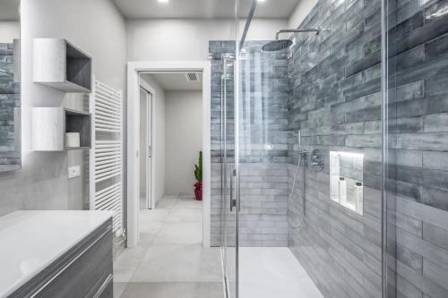 a bathroom with a shower and a glass shower stall at Borgo degli Ulivi in Formigine