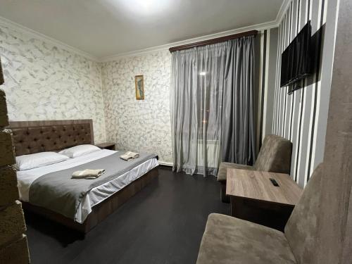Postel nebo postele na pokoji v ubytování Baron Hotel