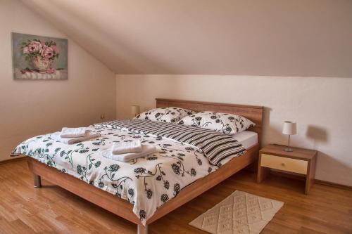 a bedroom with a large bed in a room at Apartment Silvia in Slunj