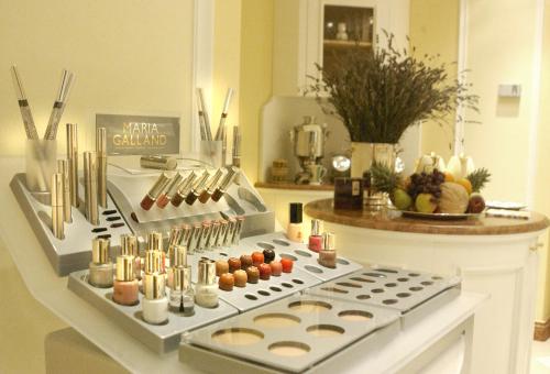 a kitchen counter with a stove with candles on it at Grand Hotel Liberty in Riva del Garda